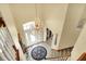 Grand foyer with a chandelier, staircase and circular rug at 4704 Pearcrest Way, Greenwood, IN 46143