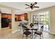 An eat-in kitchen with an island and counter seating opens to a dining area with large sliding doors to the exterior at 4704 Pearcrest Way, Greenwood, IN 46143