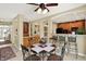 Open floor plan eat-in kitchen with island, counter seating, and black appliances, and easy access to other rooms at 4704 Pearcrest Way, Greenwood, IN 46143