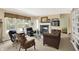 Bright living room features a fireplace, large windows overlooking the pool, and ample seating at 4704 Pearcrest Way, Greenwood, IN 46143