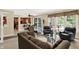 Comfortable living room with backyard views and access to a spacious kitchen at 4704 Pearcrest Way, Greenwood, IN 46143