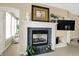 Living room featuring fireplace, wall-mounted television and comfortable furniture at 4704 Pearcrest Way, Greenwood, IN 46143