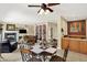 The living room and kitchen boast an open floor plan, featuring warm colors, tile floors, and a fireplace at 4704 Pearcrest Way, Greenwood, IN 46143