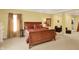 Beautiful main bedroom with comfortable furnishings, large bed, and seating area at 4704 Pearcrest Way, Greenwood, IN 46143