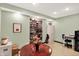 Office space with built in bookshelves, storage, and large table at 4704 Pearcrest Way, Greenwood, IN 46143