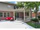 Covered patio with a comfortable outdoor seating area perfect for relaxation, adjacent to a beautifully landscaped backyard at 4704 Pearcrest Way, Greenwood, IN 46143