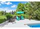 Inviting backyard patio featuring cozy seating, a fire pit, and a serene outdoor space, perfect for relaxing and entertaining guests at 4704 Pearcrest Way, Greenwood, IN 46143