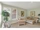 Bright sitting room filled with natural light and comfortable furniture at 4704 Pearcrest Way, Greenwood, IN 46143
