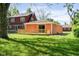 A lush green backyard with a newly-built deck at 4904 E 14Th St, Indianapolis, IN 46201
