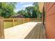 An outdoor wooden deck surrounded by a green lawn at 4904 E 14Th St, Indianapolis, IN 46201
