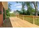 An outdoor wooden deck surrounded by a green lawn at 4904 E 14Th St, Indianapolis, IN 46201