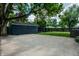View of the backyard featuring a shed, dark privacy fence, and mature trees at 5660 Crittenden Ave, Indianapolis, IN 46220
