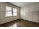 Cozy bedroom with classic wallpaper, hardwood floors, and ample natural light at 5660 Crittenden Ave, Indianapolis, IN 46220