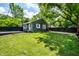 Charming home featuring a well-maintained lawn, dark fencing, and delightful curb appeal at 5660 Crittenden Ave, Indianapolis, IN 46220