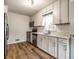Bright kitchen features stainless steel appliances, subway tile backsplash, and updated cabinetry at 5660 Crittenden Ave, Indianapolis, IN 46220