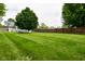 Spacious, well-maintained backyard featuring a privacy fence and lush green lawn at 6118 Yellow Birch Ct, Avon, IN 46123