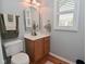 Cozy bathroom with light fixtures, a vanity, and a mirrored window at 6118 Yellow Birch Ct, Avon, IN 46123