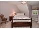 Bedroom with a bed, carpeted floors, a bedside table and a window seat at 6118 Yellow Birch Ct, Avon, IN 46123