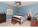 Bedroom featuring blue walls, a ceiling fan, carpet and classic furniture at 6118 Yellow Birch Ct, Avon, IN 46123