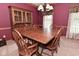 Formal dining room boasting rich wooden furniture, traditional decor, and elegant lighting for sophisticated dinners at 6118 Yellow Birch Ct, Avon, IN 46123