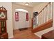 Inviting foyer with a grand staircase, hardwood floors, and a striking grandfather clock at 6118 Yellow Birch Ct, Avon, IN 46123