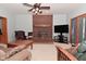 Cozy living room with brick fireplace, plush seating, and ample natural light for a comfortable atmosphere at 6118 Yellow Birch Ct, Avon, IN 46123
