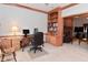 Comfortable office space with wood trim, built-in bookcase and carpeted floors at 6118 Yellow Birch Ct, Avon, IN 46123