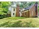 The back of the house has a brick chimney, brick accents, and a screened in porch area at 6280 N Chester Ave, Indianapolis, IN 46220