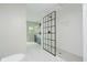 Modern bathroom featuring a glass enclosed shower, subway tile, and a stylish vanity at 6280 N Chester Ave, Indianapolis, IN 46220