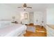 Bedroom featuring hardwood floors, a ceiling fan, and dresser at 6280 N Chester Ave, Indianapolis, IN 46220