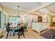 Traditional dining room with a wood table set, and open floor plan to kitchen at 6280 N Chester Ave, Indianapolis, IN 46220