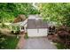 Garage of home featuring a cupola and with balcony above surrounded by mature trees at 6280 N Chester Ave, Indianapolis, IN 46220
