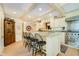 Spacious kitchen features a center island with barstool seating and stainless steel appliances at 6280 N Chester Ave, Indianapolis, IN 46220