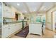 Well-lit kitchen with granite counters, a center island and an open floor plan at 6280 N Chester Ave, Indianapolis, IN 46220