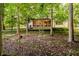 View of the back of the house showing screened porch with neutral coloring and ample privacy and shade at 6280 N Chester Ave, Indianapolis, IN 46220