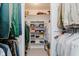 Organized walk-in closet with ample shelving and hanging space for clothes and accessories at 6280 N Chester Ave, Indianapolis, IN 46220