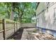 An inviting fenced backyard featuring a concrete patio and green foliage, perfect for outdoor gatherings at 629 E 25Th St, Indianapolis, IN 46205