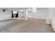Basement with neutral carpet, white walls and a window allows light into the space at 629 E 25Th St, Indianapolis, IN 46205
