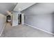Bedroom features neutral carpet, gray walls, sloped ceilings and access to a bathroom at 629 E 25Th St, Indianapolis, IN 46205