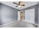Bedroom with gray walls features a ceiling fan and neutral carpet, offering a comfortable and serene space at 629 E 25Th St, Indianapolis, IN 46205