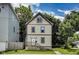 Charming two-story home featuring updated siding, front porch and manicured front lawn at 629 E 25Th St, Indianapolis, IN 46205