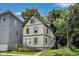 Charming two-story home featuring updated siding, front porch and manicured front lawn at 629 E 25Th St, Indianapolis, IN 46205