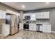 Modern kitchen with stainless steel appliances and granite countertops at 629 E 25Th St, Indianapolis, IN 46205