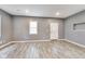 Bright living room featuring fresh paint and modern laminate flooring at 629 E 25Th St, Indianapolis, IN 46205