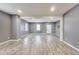 Bright living room featuring fresh paint and modern laminate flooring at 629 E 25Th St, Indianapolis, IN 46205