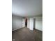 Bedroom features a closet and view into the next room at 6632 Coppel Ct, Indianapolis, IN 46259