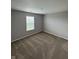 Bedroom with neutral carpet, window and grey walls at 6632 Coppel Ct, Indianapolis, IN 46259