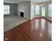 Open-concept living room with carpet and hardwood floors, fireplace, natural light at 6632 Coppel Ct, Indianapolis, IN 46259
