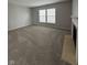 Bright living room with large windows, neutral walls, carpet and fireplace at 6632 Coppel Ct, Indianapolis, IN 46259