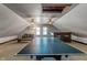 Expansive finished attic with wet bar and a ping pong table, perfect for entertainment and relaxation at 718 E Washington St, Lebanon, IN 46052